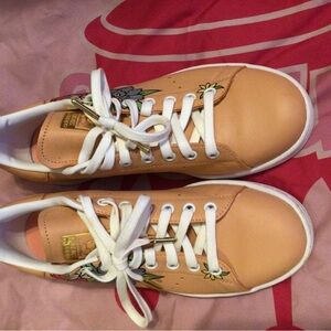 Adidas shoe with flower on the side peach color